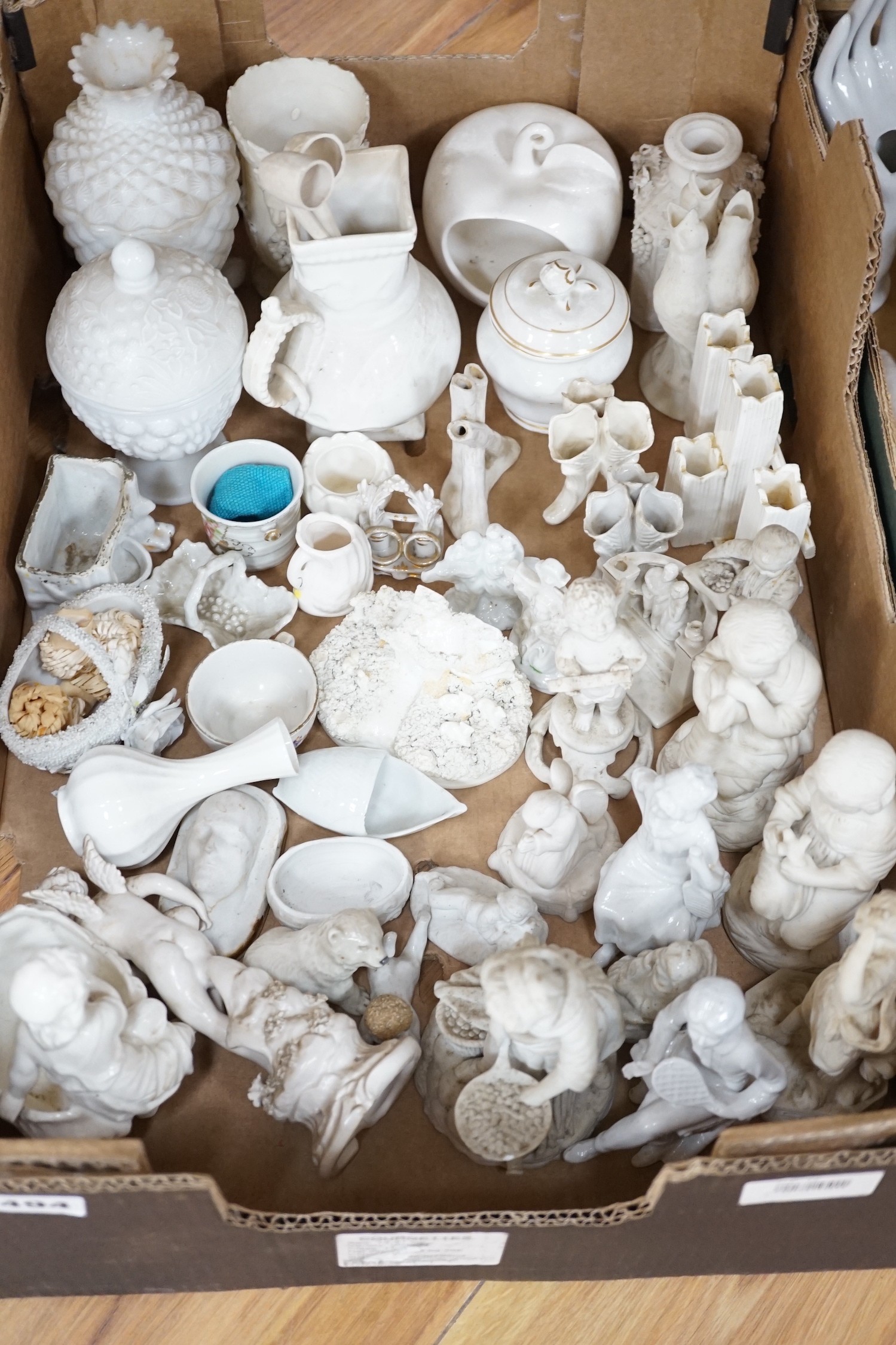A large collection of mostly 19th century white glazed ceramics, including ring trees, model hands, figurines, vases and other coloured ceramics (five boxes)